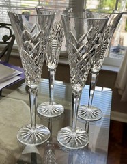4 Waterford Champagne Christmas Glasses Holiday Treasures 10 1/2 inches high.