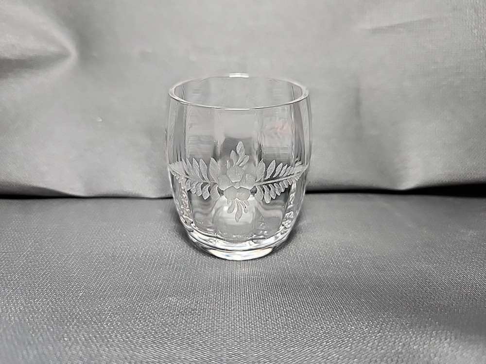 Antique etched glass cordial glass with floral and leaf motifs.