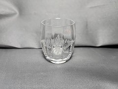 Antique etched glass cordial glass with floral and leaf motifs.