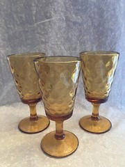 3 amber glass inverted thumbprint goblets. No chips or cracks. 7 inches. Heavy