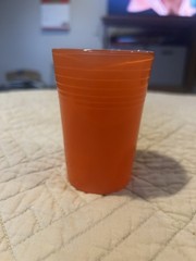 1 Swanky Swigs; Carnival Glass in orange 3 1/2″