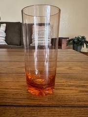 Peach pink depression highball glass with cut starburst pattern on bottom ~10oz