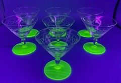 SEVEN (7) CLEAR DEPRESSION GLASS CHAMPAGNE SHERBETS WITH GREEN URANIUM BASES