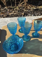 These items appear to be vintage pressed glass, specifically turquoise blue