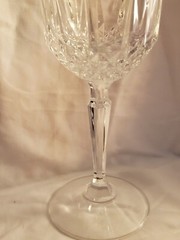 Vintage Crystal Glassware holds 10 ounces of liquid. The glass is 8 inches tall