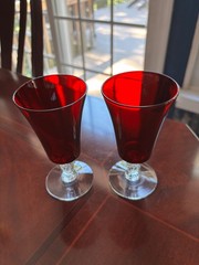 VINTAGE PAIR OF RUBY RED AND CLEAR STEMMED FOOTED JUICE GLASSES 5″ HIGH