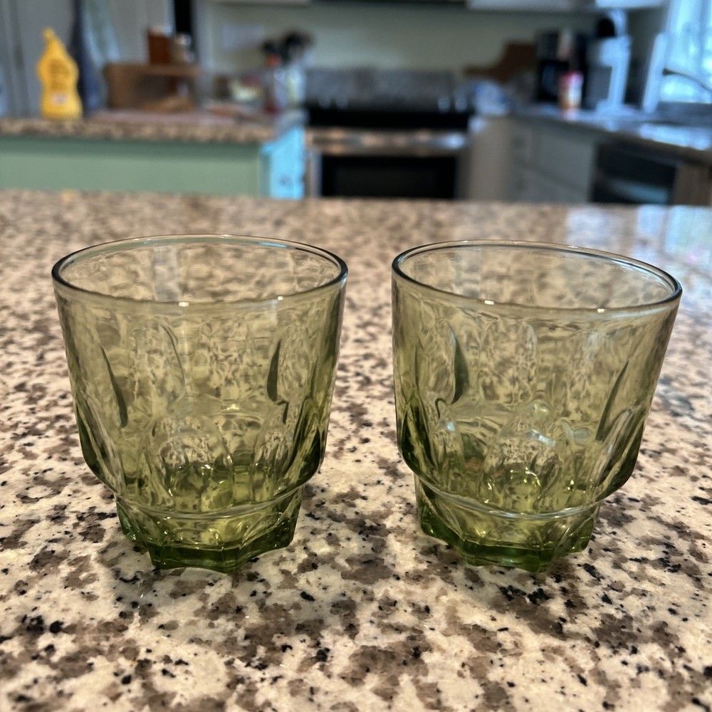 A pair of vintage Hazel Atlas avocado green Thumbprint textured glass tumblers.