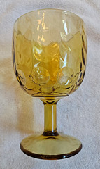 Amber Glass Stemmed Goblet Drinking Glass Thumbprint Pattern Round