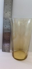 Set of 9 vintage amber glass tumblers with a flared rim.