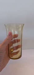 Set of 9 vintage amber glass tumblers with a flared rim.