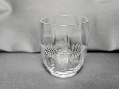 Antique etched glass cordial glass with floral and leaf motifs.