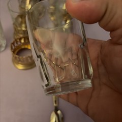 Vintage Japan tea glasses with ornate gold-toned metal holders and spoons.