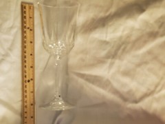 Vintage Crystal Glassware holds 10 ounces of liquid. The glass is 8 inches tall