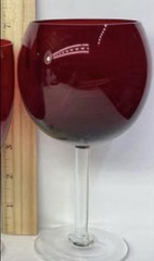Set of (4) Rare 7” tall water/wine glasses. Ruby red. Manufacturer unknown.