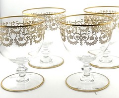 Set Of 4 Baccarat crystal gilded water goblet in the Flora pattern. Signed