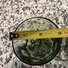 A pair of vintage Hazel Atlas avocado green Thumbprint textured glass tumblers.