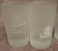 JAGERMEISTER GLASS PITCHER , (4) 2cl & (2) 4cl shot glasses, & (1) 0,11/ra glass