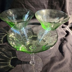 Set of three Fostoria uranium glass twisted stem coupes with clear faceted bowls