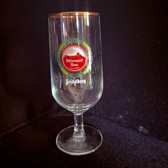A stemmed beer glass for Schlossquell Biere from Germany with Gold rim.