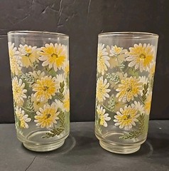 Vintage Libbey Daisy glasses featuring a raised yellow and white floral design