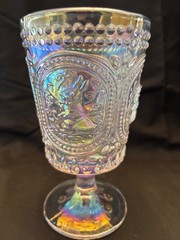 Beautiful iridized clear glass goblet with a bunny rabbit theme. 6 inches tall.