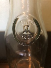 VINTAGE EMBOSSED «SINCE 1852» 9 1/2 IN HI GLASS WINE MILK BOTTLE CARAFE DECANTER