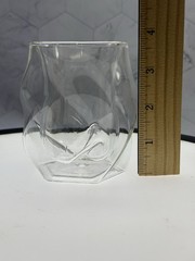 (1) double-walled glass tumbler features a unique twisted, ergonomic design