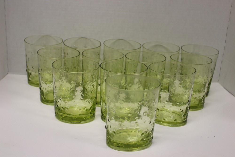Set of 13 oval, green bubbled glass drinking glasses, 12 fluid oz capacity