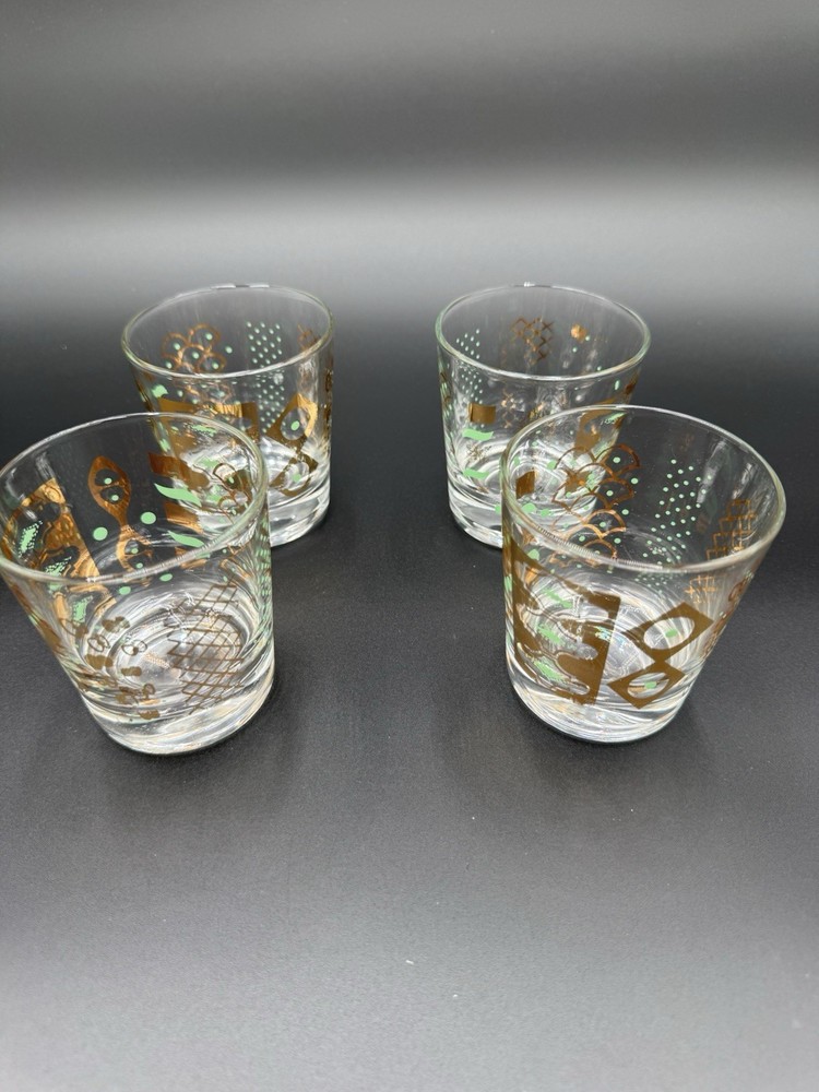 4 Glasses 3 1/2 Inches Tall With gold And green Accents