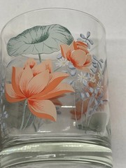 Vintage art glass tumblers with floral and lily pad design, signed © N. Carter.