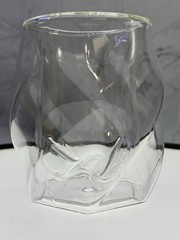 (1) double-walled glass tumbler features a unique twisted, ergonomic design
