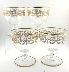 Set Of 4 Baccarat crystal gilded water goblet in the Flora pattern. Signed