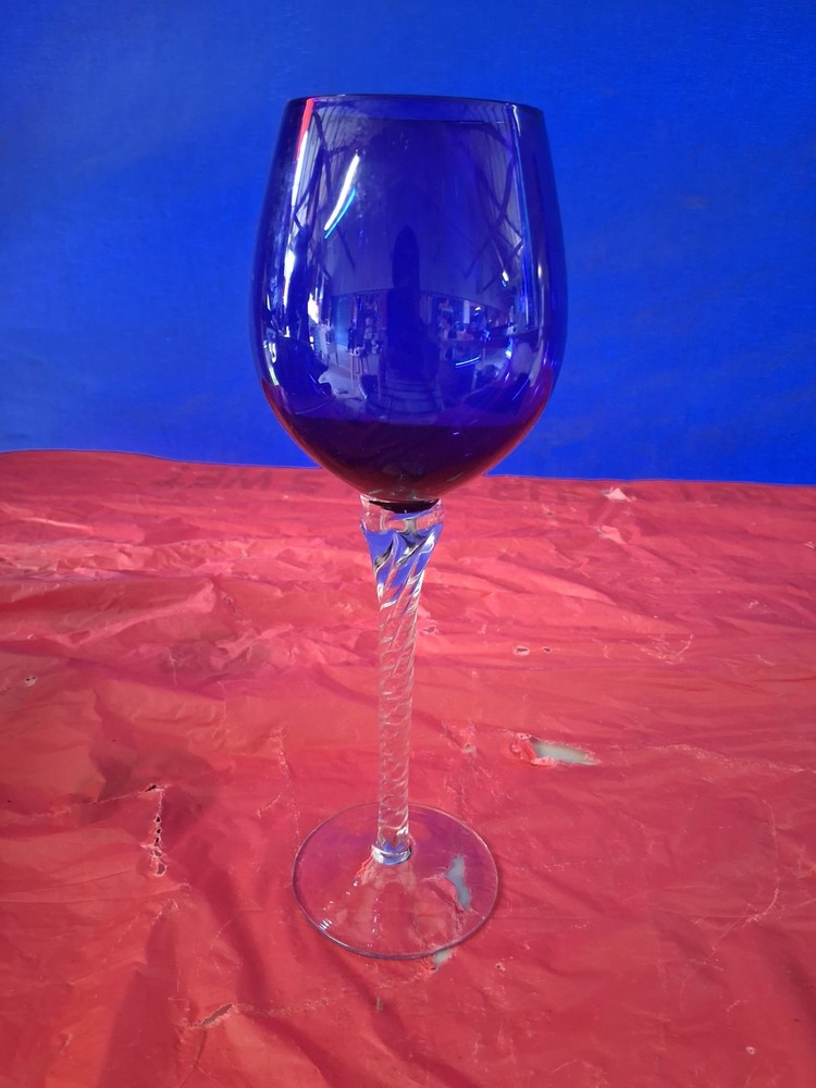 This is a vintage cobalt blue and clear twisted stem wine glass