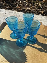 These items appear to be vintage pressed glass, specifically turquoise blue