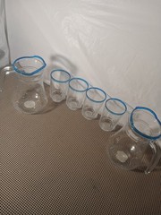 A Set of Lemonade Glasses 4 Cups and 2 Pitchers with Blue Stripes