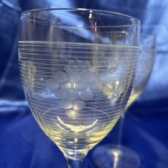 Vintage depression Era cordial glasses feature a «Grape on Grid» etched pattern