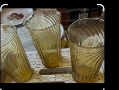 vintage amber glass tumblers featuring a distinct swirl or fluted pattern