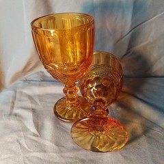 Amber colored glass pedestal goblets, Pair