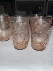Set of 4 pink juice glasses (4-3/4”h) with fruit motif. Made in Italy
