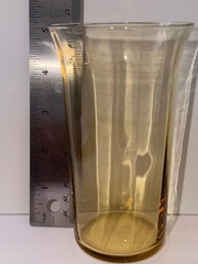 Set of 9 vintage amber glass tumblers with a flared rim.