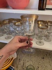 Vintage Tiffin-Franciscan gold-leaf-rimmed glassware set of 29