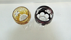 2 RED AND AMBER CUT TO CLEAR 4-1/3 & 4-3/4 GLASSES W/ GRAPE DESIGN CUT STEM