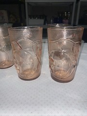 Set of 4 pink juice glasses (4-3/4”h) with fruit motif. Made in Italy