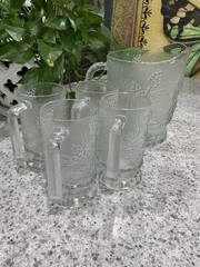 Set of 5 pieces, a pitcher 68 oz, 4 /12 oz mugs Tiara Indianna Glass.