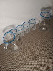 A Set of Lemonade Glasses 4 Cups and 2 Pitchers with Blue Stripes
