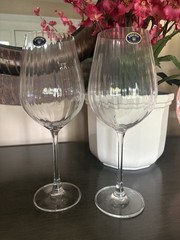 A clear Bohemia crystal wine glass with an optic pattern.
