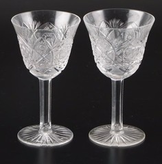 Pair of ca.1970 cut glass wine goblets 5.75″ h by 3.25″,stars, crosshatch,arches