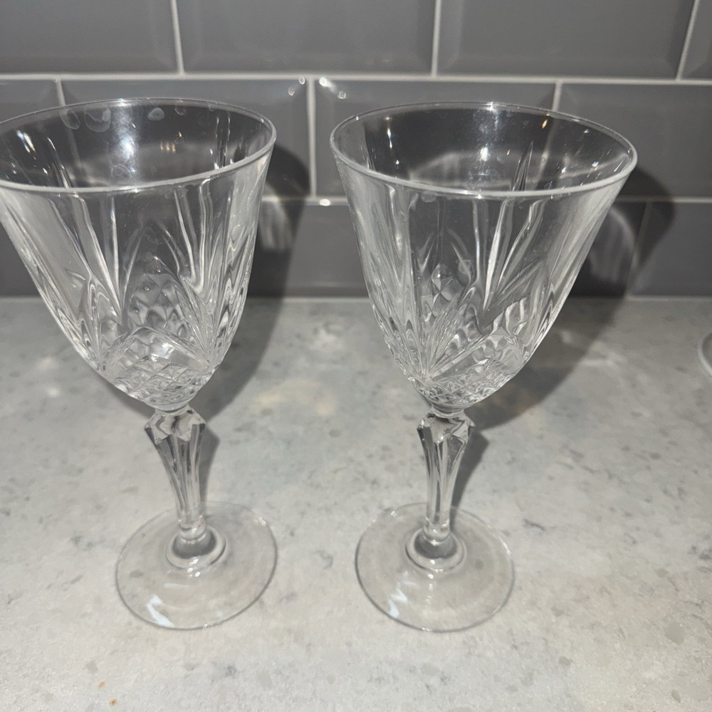 2 Crystal Wine Glasses. 7.5 inches tall and 6 ounce capacity.
