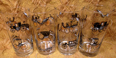 4 weighted base glass tumblers w/antique black automobiles -5.5″ high 12oz. cap.