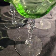 Set of three Fostoria uranium glass twisted stem coupes with clear faceted bowls